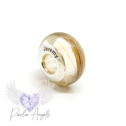 hair bead with no sparkle mix, engraved blank bead core with Arial font. The inside of the bead core is painted white to cover the core