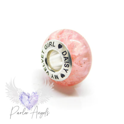 pink engraved ashes bead, fairy pink unicorn sparkle mix with cremation ashes. Beachball resin technique with finely ground ashes. Arial font engraved bead in all caps with heart emojis